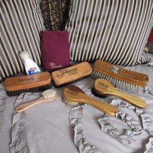 lot of vintage shoe shine brushes